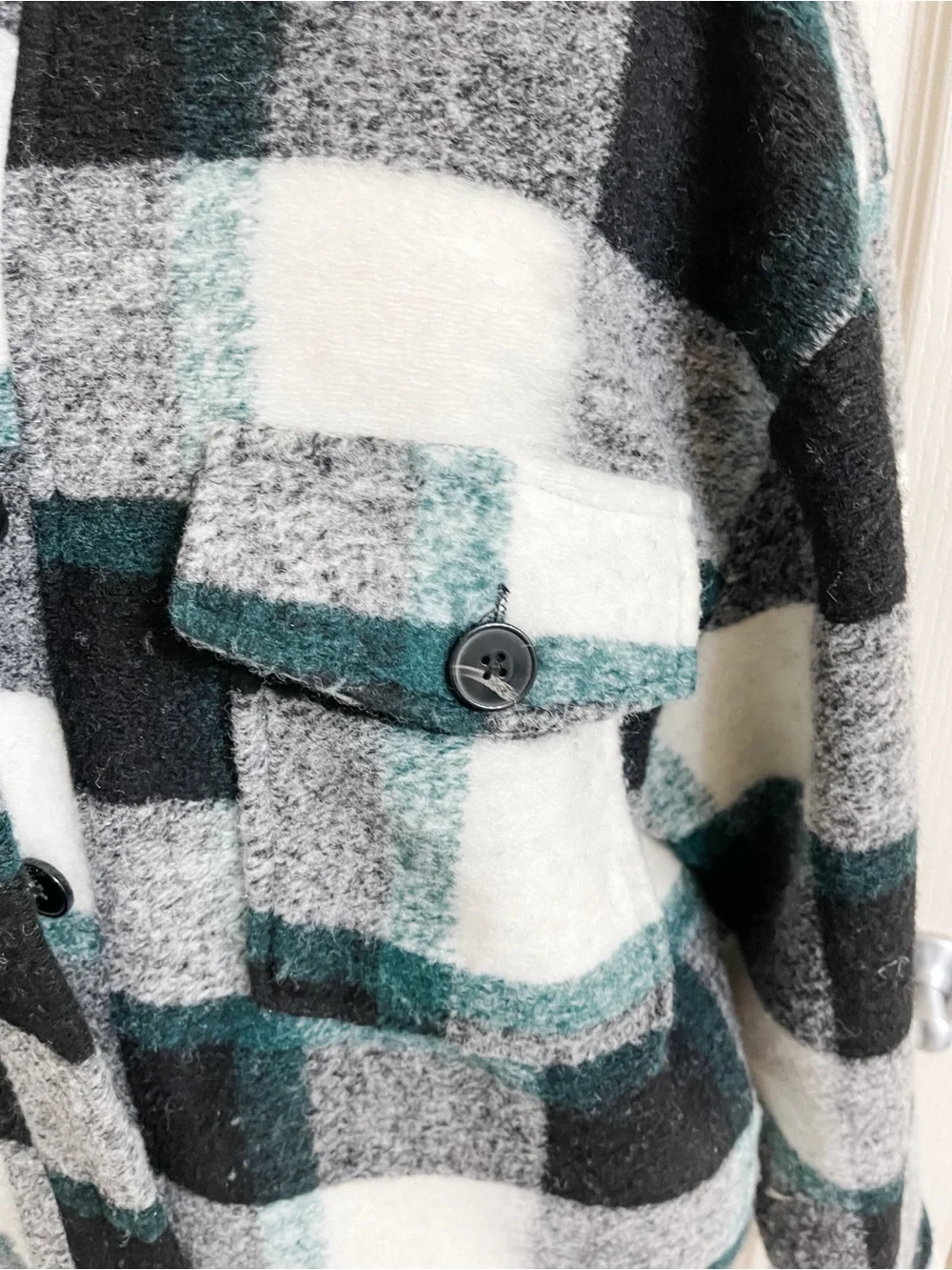 Buckle cozy plaid
